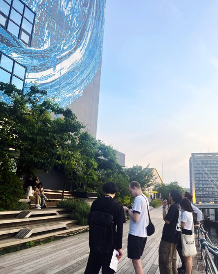 Group viewing building wall art