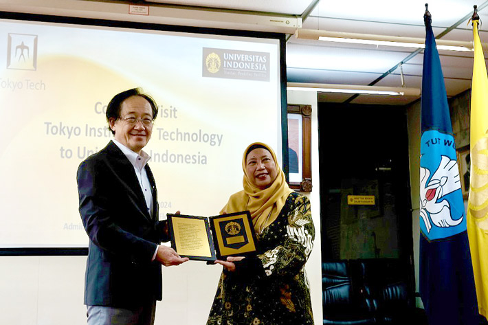 Masu (left) at University of Indonesia with Secretary to the University Kusumayati